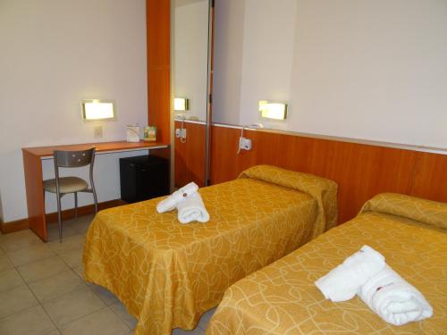 Postel nebo postele na pokoji v ubytování Hotel Necof
