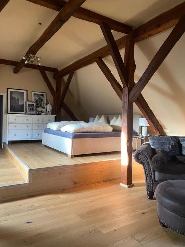 a bedroom with a bed in the attic at Altbauwohnung mit Fachwerk in Anif