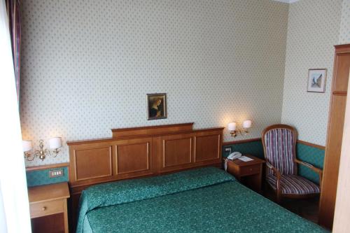 Ένα ή περισσότερα κρεβάτια σε δωμάτιο στο Villa Belvedere