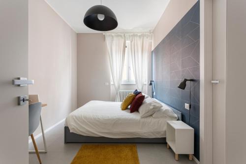 A bed or beds in a room at bilocale Aleardi