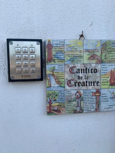 a remote control attached to a wall with a map at Torre San Bonifacio - Locazione Turistica in San Bonifacio