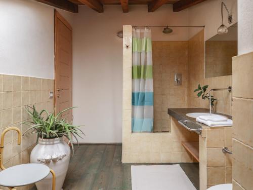 a bathroom with a sink and a shower at Masseria Scannaturco in Marina di Pisticci