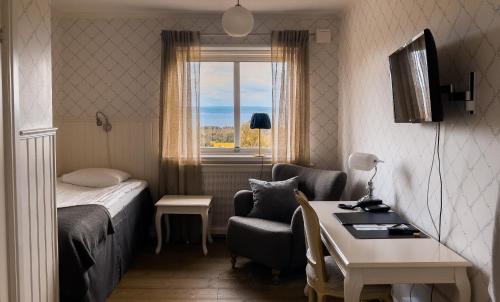 Postel nebo postele na pokoji v ubytování Hotell Villa Långbers