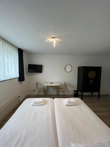 Katil atau katil-katil dalam bilik di Seehotel Oostkapelle