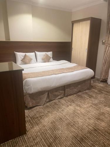 Postel nebo postele na pokoji v ubytování فندق سمى الخير