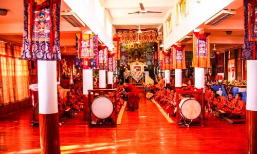 a group of people sitting in a room with drums at Prakriti Aalay - Riverside Mountain View Boutique Eco Resort in Dharamshala