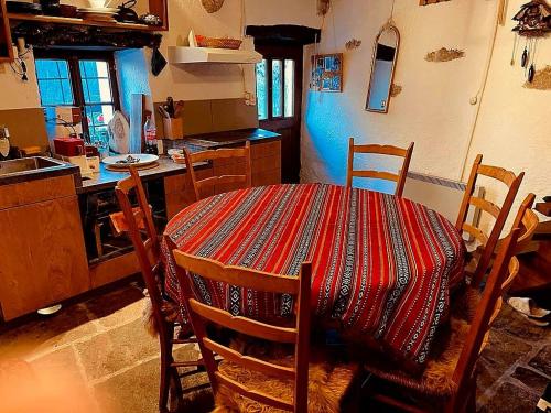 a kitchen with a table with a table cloth on it at Casa Roberto Corippo 