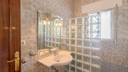 a bathroom with a sink and a mirror at Villa la Quinta Priego de Córdoba by Ruralidays in Priego de Córdoba