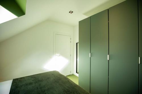 Postel nebo postele na pokoji v ubytování City Housing Genk