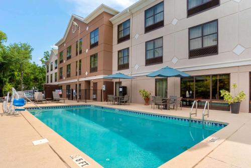 a swimming pool in front of a building at Comfort Suites Tallahassee Downtown in Tallahassee