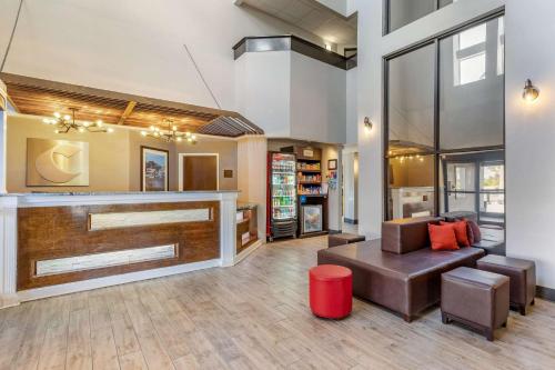 a living room with a couch and a table at Comfort Suites Southport - Oak Island in Southport