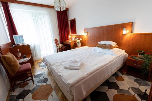 Postel nebo postele na pokoji v ubytování HELIOS Hotel Apartments