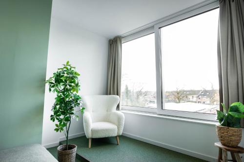 Posezení v ubytování City Housing Genk