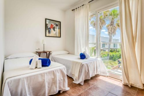 Giường trong phòng chung tại Villa Punta Grossa