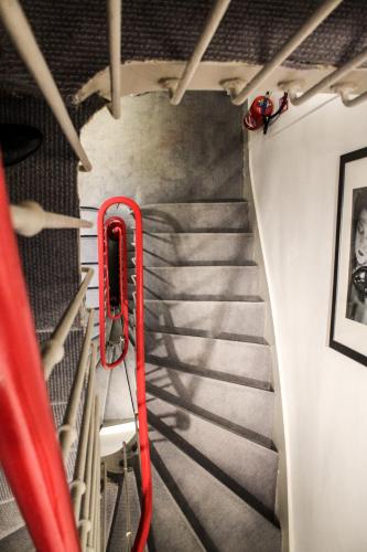 a staircase with a red fire hydrant on a bus at Hôtel des Arts in Toulouse