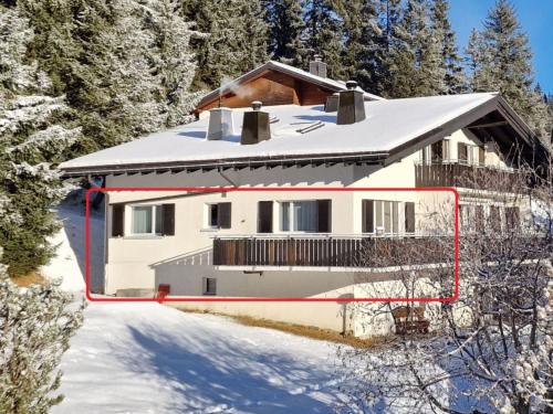 a house in the snow with snow covered trees at Apartment Segl Crest Süd by Interhome in Valbella