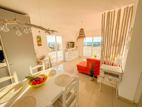 a kitchen and living room with a table and chairs at Torrenueva , La Cala De Mijas , Vistamar , Go to costa in La Cala de Mijas