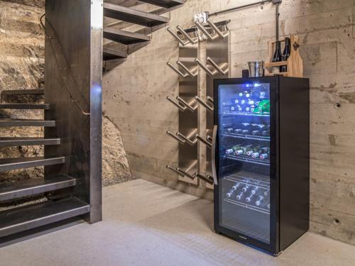 a vending machine in a room with a staircase at Apartment Josefa am Buchhammerhof by Interhome in Kaunerberg