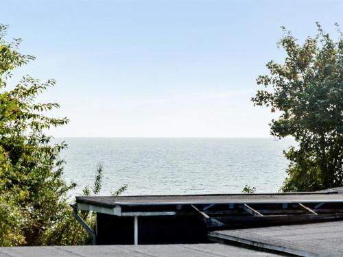 a view of the ocean from a house at Holiday Home Ilkka - 175m from the sea in Sealand by Interhome in Rødvig