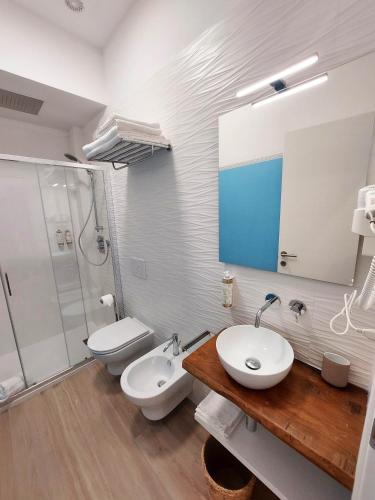 a bathroom with a sink and a toilet and a shower at Affittacamere Casa Lilibet in San Benedetto del Tronto