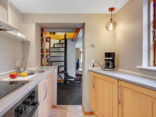 a kitchen with a sink and a counter top at Holiday Home Marilena - 300m from the sea by Interhome in Rudkøbing