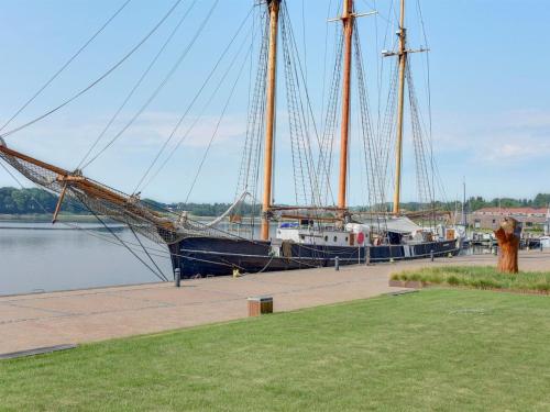 a large boat is docked in the water at Apartment Maja - 100m from the sea by Interhome in Gråsten
