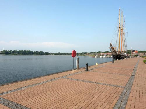 a brick walkway next to a body of water at Apartment Maja - 100m from the sea by Interhome in Gråsten