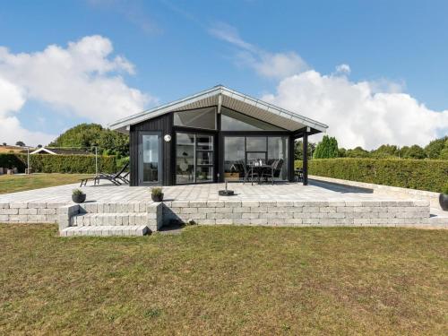 a small house with a glass roof at Holiday Home Beowulf - 200m from the sea by Interhome in Broager