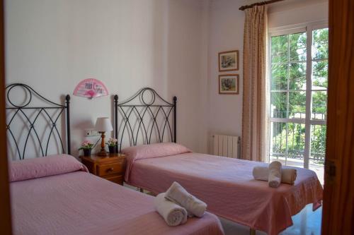 Postel nebo postele na pokoji v ubytování Nerja Paradise Rentals - Villa Flamingo