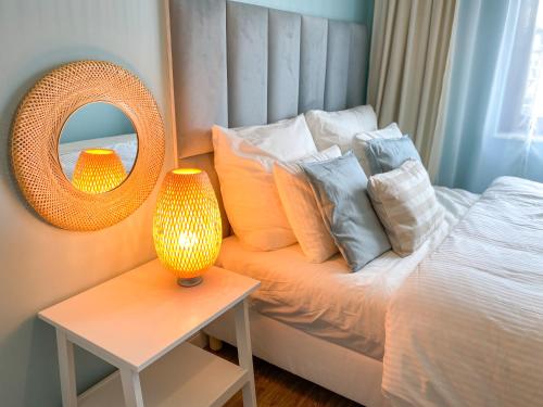 Postel nebo postele na pokoji v ubytování Apartament Akwamaryn