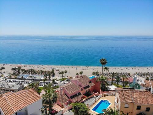 an aerial view of a beach and the ocean at Nerja Paradise Rentals - Villa Dos Ardillas in Nerja