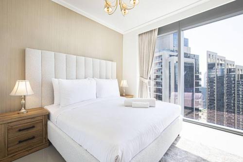 Postel nebo postele na pokoji v ubytování Stay Holiday Homes by Al Ghurair - Downtown Opera Grand - Dubai