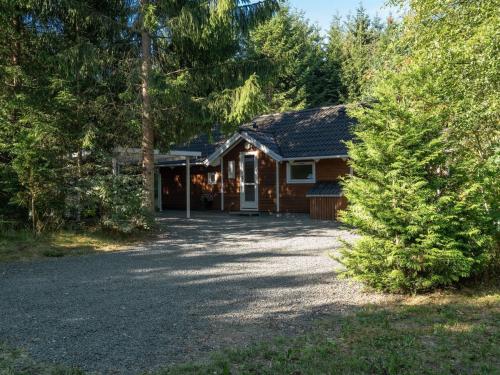 a house with a gravel driveway in front of it at Holiday Home Ellica - 3km from the sea in SE Jutland by Interhome in Give