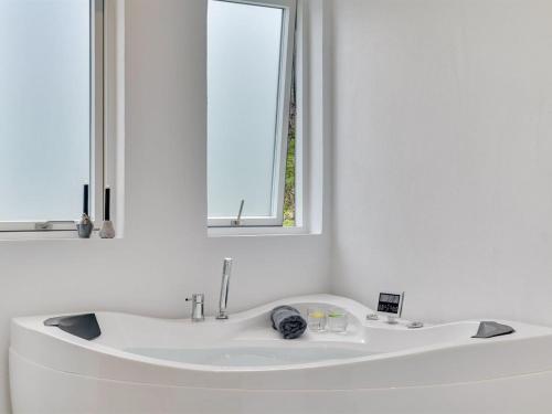 a white sink in a bathroom with a mirror at Holiday Home Elso - 600m to the inlet by Interhome in Struer