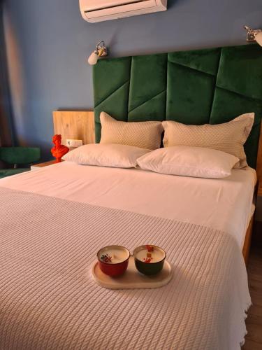 a bed with two bowls on top of it at Ekin Otel Göcek in Göcek