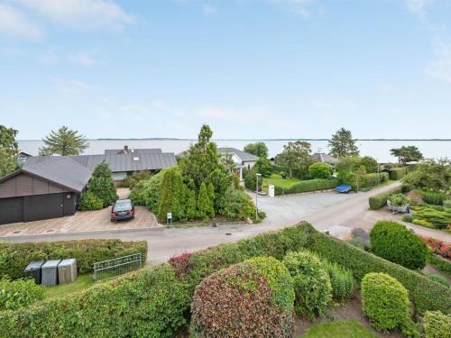 an aerial view of a house with a driveway at Holiday Home Regni - 300m to the inlet in The Liim Fiord by Interhome in Nykøbing Mors