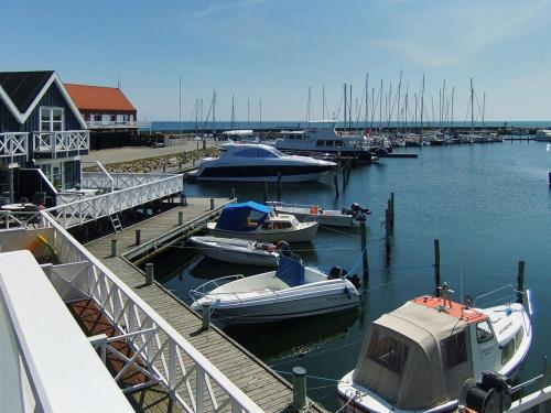 a group of boats docked at a marina at Holiday Home Knud - 2m from the sea in Djursland and Mols by Interhome in Grenå