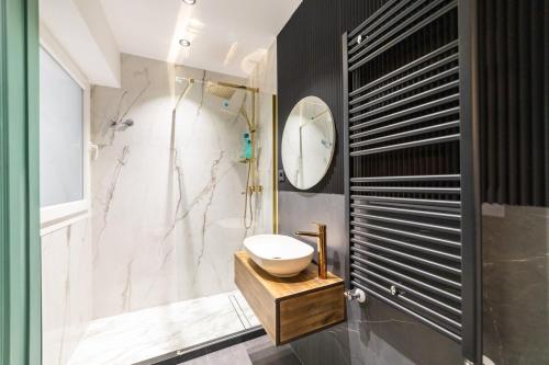 a bathroom with a sink and a shower at Luxury City Centre in Alicante