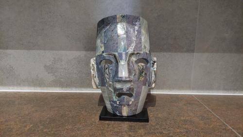 a mask sitting on a stand in a room at Apartament Nr 50, 2 sypialnie, wygodny parking podziemny in Toruń