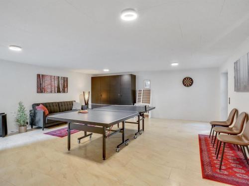 a living room with a ping pong table in it at Holiday Home Andri - 600m to the inlet in The Liim Fiord by Interhome in Løgstør