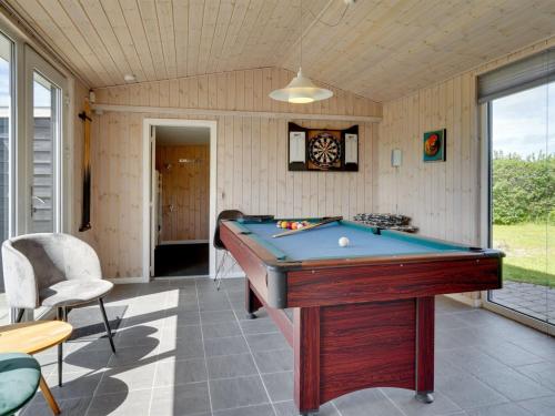 a room with a pool table in a house at Holiday Home Edel - 650m from the sea by Interhome in Hadsund