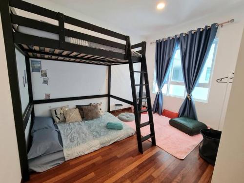 a bedroom with a bunk bed with a ladder at Impiria Residensi #Link Aeon Mall Klang 4BR3Bath in Klang
