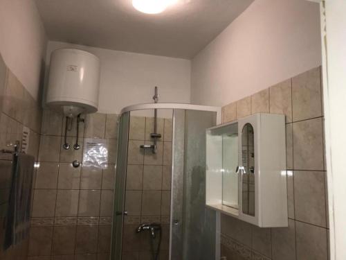 a bathroom with a shower and a toilet and a sink at Dubrovnik Rooms 2 in Dubrovnik