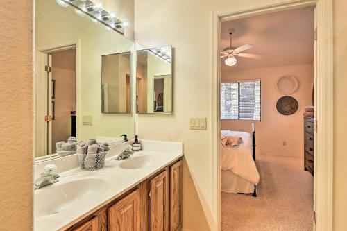 a bathroom with a sink and a mirror at Near Hiking and Golfing Pinetop Home with Deck! in Indian Pine