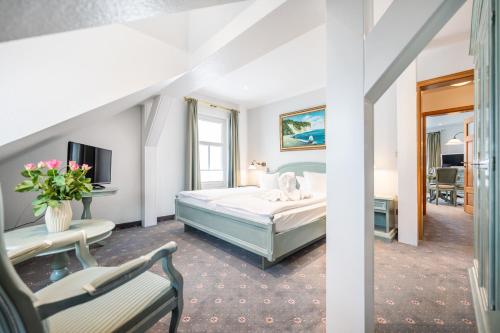 Postel nebo postele na pokoji v ubytování Hotel Villa Neander