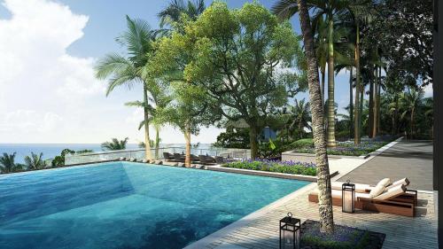 una piscina con palmeras y el océano en Palau Sunrise Sea View Landison Retreat en Melekeok