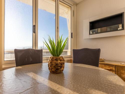 a dining room with a table with a pineapple on it at Apartment Rits-4 by Interhome in Salou
