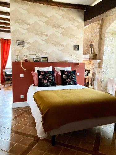 a bedroom with a large bed in a room at Chambre Loulou • Maison Colombage in Provins