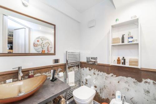 a bathroom with a sink and a toilet at [Loft in centro] Boutique 65 in Turin