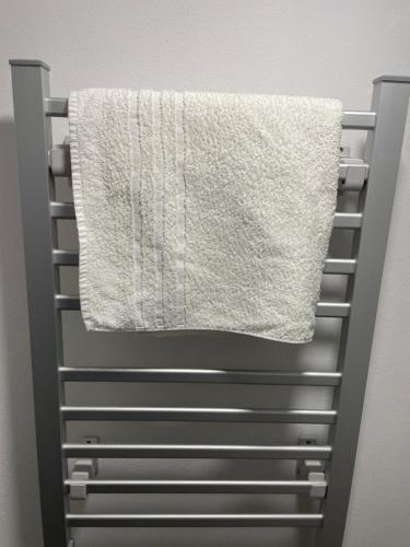 a towel hanging on a towel rack in a bathroom at ICE APARTMENT in Ljubljana